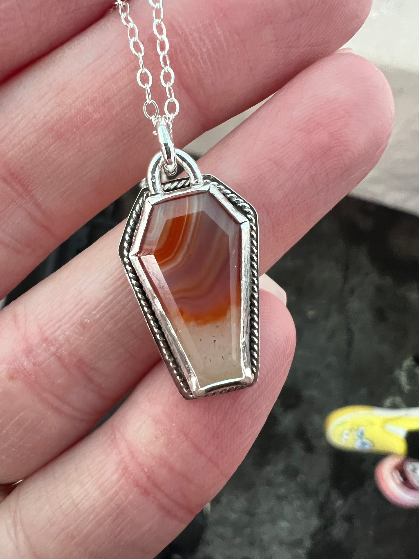 orange coffin necklace